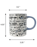 Katie Merz Mug with Blue Handle and Glyph Art