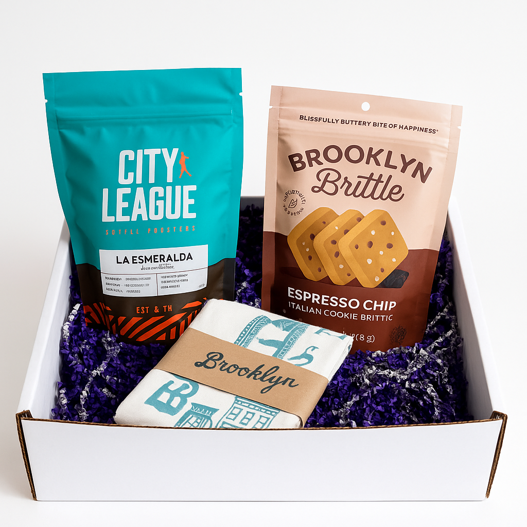 Three snack packages from City League, Brooklyn Brittle, and a box with 'Brooklyn' branding on a white background.