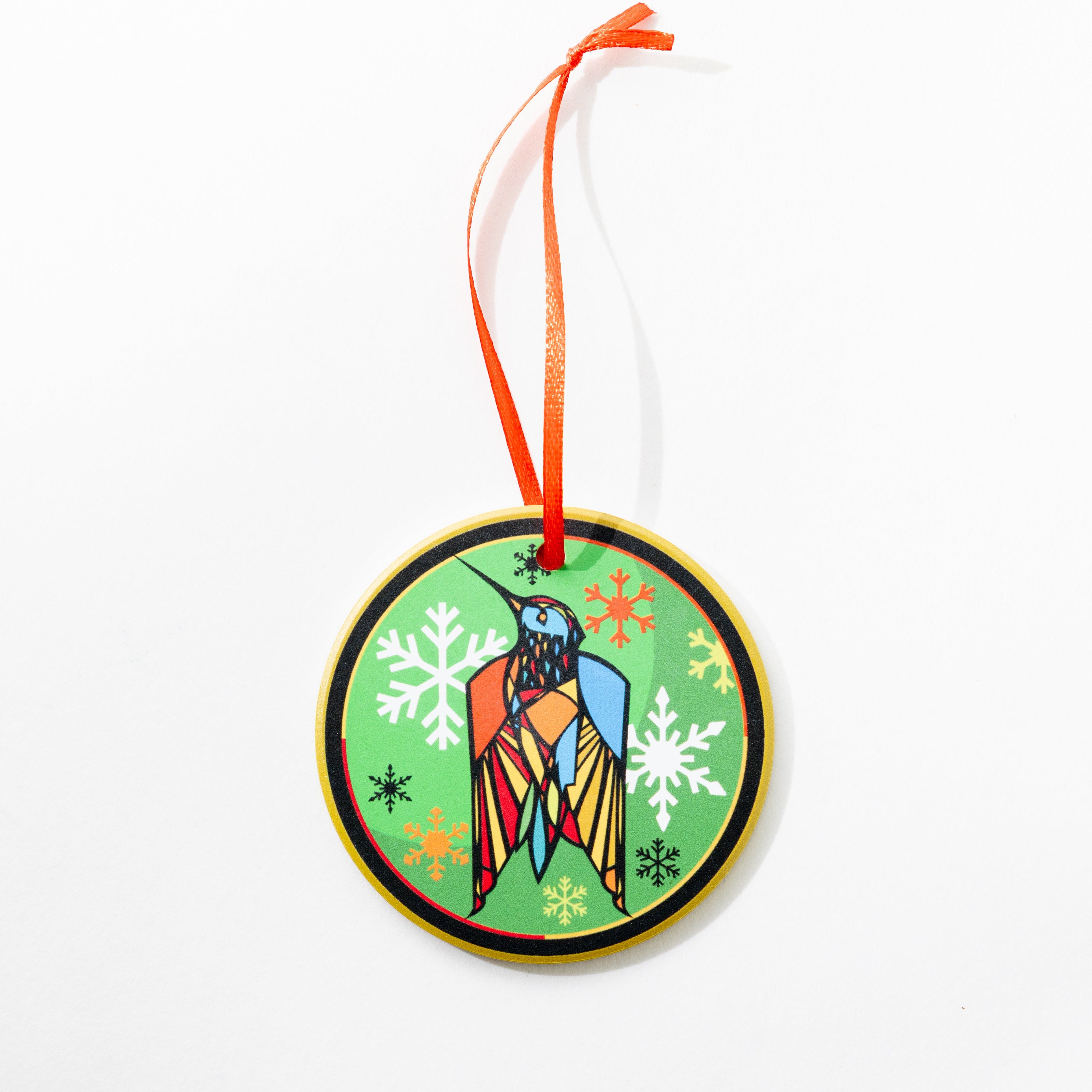 CAM Craig Anthony Miller Artist Ceramic Decorative Christmas ornament with a colorful bird design on a white background