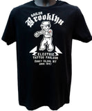 Black t-shirt with white graphic design and text on a white background