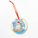 Stanley Lambert Artist Ceramic Decorative ornament with a illustrated tattooed Santa with blue speech bubble saying Joy with Brooklyn Bridge in background