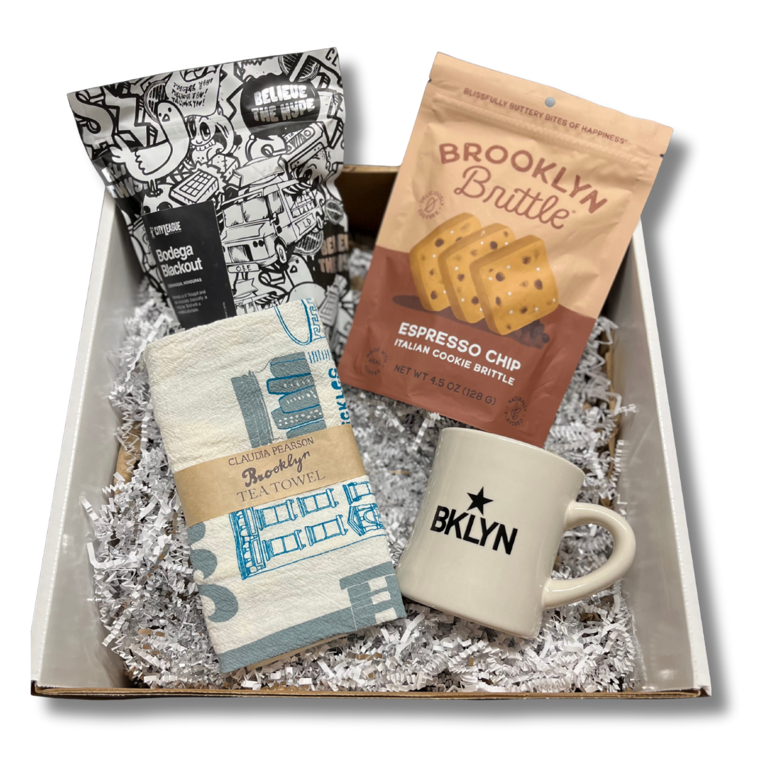 Gift set with 'City League' coffee, 'Brooklyn Brittle', and two mugs in a box.