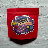 Red packaging with colorful label on a gray textured background whole bean medium to dark roast buddies coffee