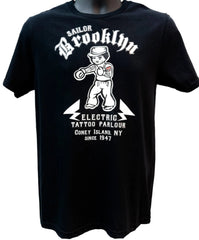 Black t-shirt with white graphic design and text on a white background